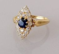 An antique sapphire and diamond navette dress ring on a yellow gold setting