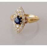 An antique sapphire and diamond navette dress ring on a yellow gold setting