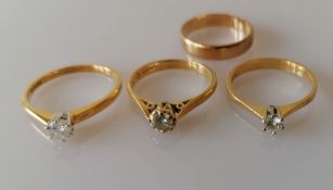 Three 18ct yellow gold solitaire diamond rings, the three claw-set round brilliant-cut diamonds