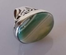 A large silver ring with oval striped agate stone, size N, boxed