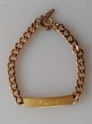 A 9ct rose gold flat curb-link identity bracelet with a yellow gold plaque, signed, hallmarked, 18.2