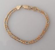 An Italian tri-gold herringbone bracelet, stamped 750, 17 cm, 8.4g