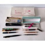 An assortment of eleven pens, pencils including 1935 Jubilee, Coronation 1953, Platignum Petit, etc