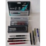 A mixed assortment of fourteen Parker fountain and ballpoint pens, four with original boxes