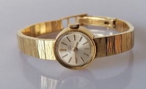 A ladies Girard Perregaux gold dress watch with silvered dial, baton markers, dial 13mm