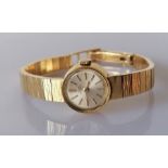 A ladies Girard Perregaux gold dress watch with silvered dial, baton markers, dial 13mm