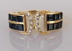 An Art Deco-style sapphire and diamond ring on a yellow gold setting