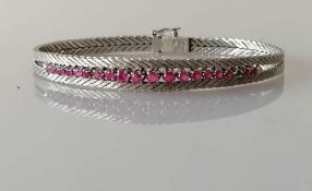 A white gold tapering herringbone bracelet with a pave-set rubies, stamped 18ct, 20.5g