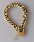 An 18ct yellow gold curb-link bracelet with heart-shape clasp, each link stamped