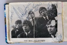 A Rolling Stones signed promo photo, circa. 1963, glued into an autograph book