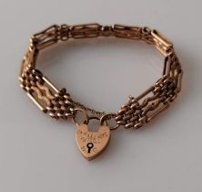 A 9ct rose gold fancy gate link bracelet with padlock clasp, stamped, inscribed, 19 cm, 16.8g