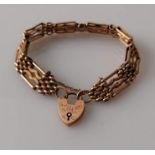 A 9ct rose gold fancy gate link bracelet with padlock clasp, stamped, inscribed, 19 cm, 16.8g