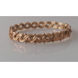 A Victorian rose gold hinged bangle with woven design, 55mm, hallmarked for Birmingham, 1893, 10.5g