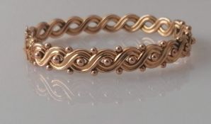 A Victorian rose gold hinged bangle with woven design, 55mm, hallmarked for Birmingham, 1893, 10.5g