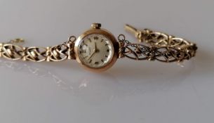 A mid century Tissot ladies manual wristwatch with a 9ct yellow gold case and bracelet, hallmarked