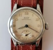 A vintage Tissot Antimagnetic watch with champagne dial, 27mm, Arabic numerals, luminous hands