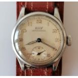 A vintage Tissot Antimagnetic watch with champagne dial, 27mm, Arabic numerals, luminous hands