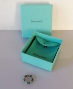 A Tiffany silver and turquoise enamel ring, size I, with original pouch and box