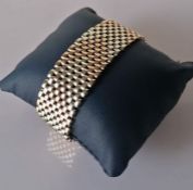 A 9ct bi-gold cuff mesh bracelet, 21mm, hallmarked, clasp good, with safety chain, 48.44g