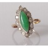 An Art Deco marquise-cut jade cocktail ring surrounded by twelve round-cut diamonds