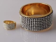 A Swarovski gold-coloured cuff hinged bangle and similar ring (2)