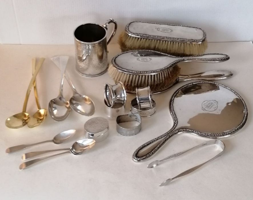 A George III silver bright-cut sugar tongs by Stephen Adams; two silver serving spoons by Thomas Cha