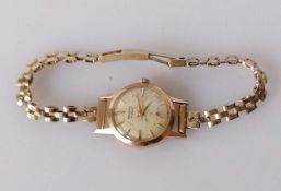 A 18ct gold-cased ladies Berthoud wristwatch with a 9ct gold strap