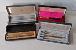A selection of four vintage Parker fountain and ballpoint pens, all boxed