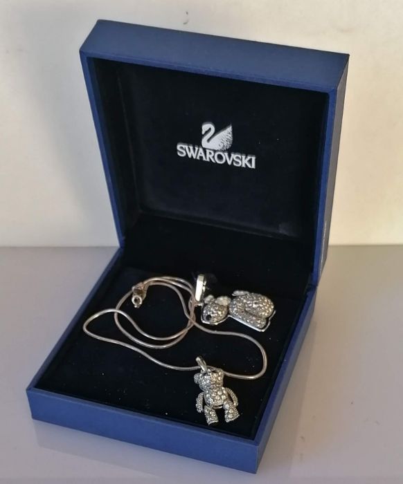 A boxed Swarovski Robby B. puppy dog 'Lovepets' charm necklace pendant and an articulated bear penda