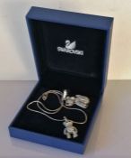 A boxed Swarovski Robby B. puppy dog 'Lovepets' charm necklace pendant and an articulated bear penda