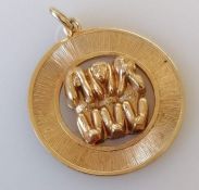 A rolled gold 'Three Wise Monkey' disc pendant charm, 3 cm diameter, with box