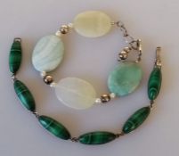 A silver bracelet with six malachite oval stones and a silver set bracelet with four oval agate ston