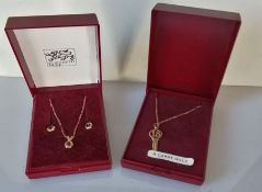 A 9ct yellow gold key pendant chain and a pendant chain with matching stud earrings, boxed, 1.8g