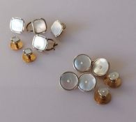 Four square gold and mother-of-pearl shirt buttons and two smaller, stamped 9ct & 18ct