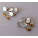 Four square gold and mother-of-pearl shirt buttons and two smaller, stamped 9ct & 18ct