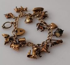 A 9ct gold charm bracelet, all hallmarked, 43.4g