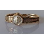 A mid-century ladies Omega gold dress watch with silvered dial, baton markers, dial 12mm