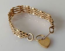 A 9ct yellow gold gate-link bracelet with heart-shape clasp, hallmarked, 16.5g