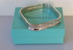 A Tiffany square silver bangle with original box, 6.5 cm internal diameter