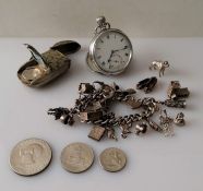 A George V silver-cased pocket watch with Roman numerals; a silver charm bracelet