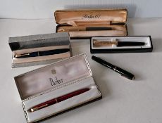 A collection of five vintage Parker fountain pens including model 61 Duofold vacumatic, four boxed