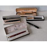 A collection of five vintage Parker fountain pens including model 61 Duofold vacumatic, four boxed