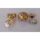 Two vintage yellow gold dress rings, one with pearl decoration, the other with foliage design