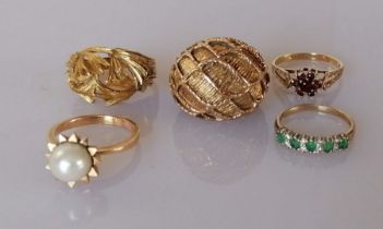 Two vintage yellow gold dress rings, one with pearl decoration, the other with foliage design