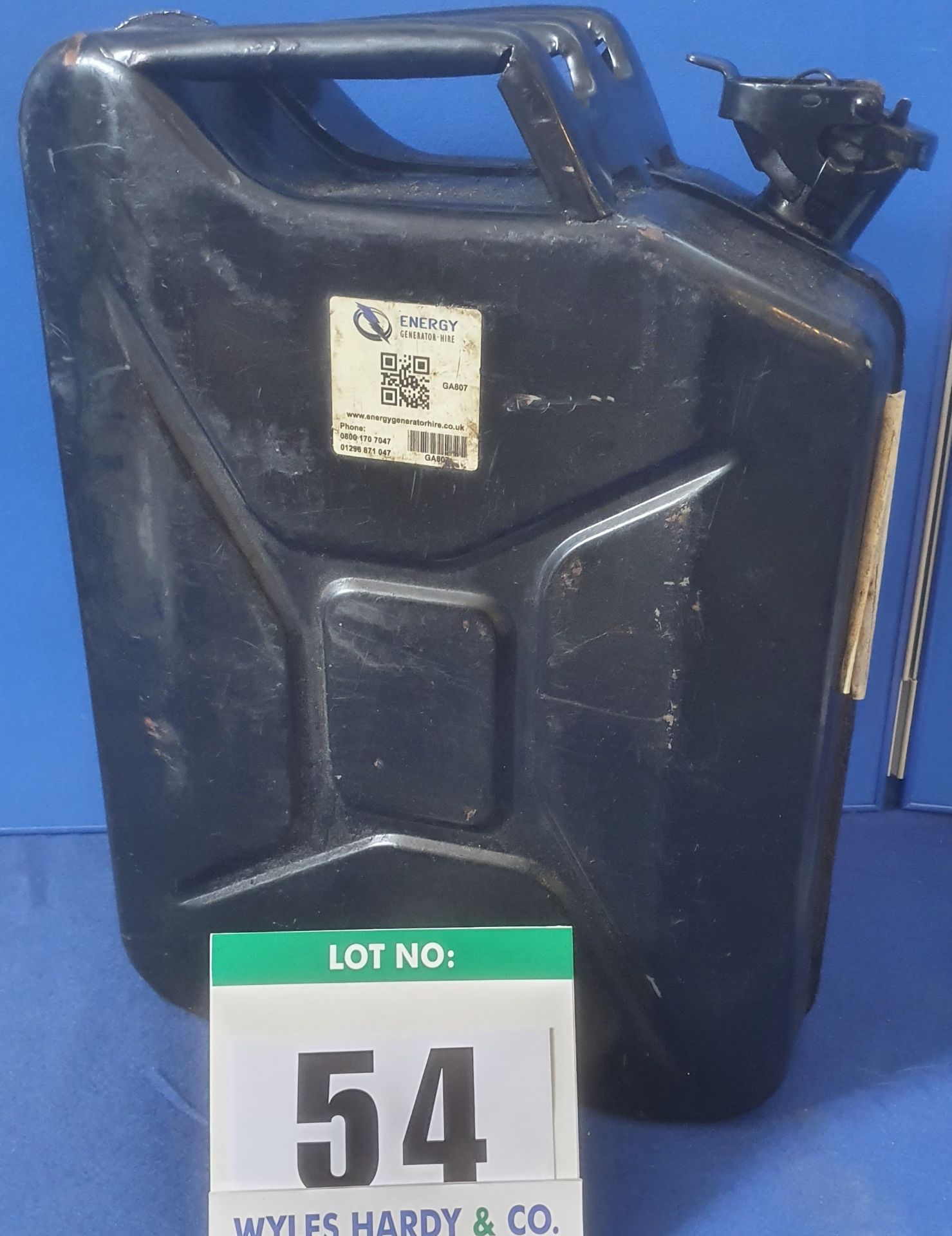 A Black Steel 20--Litre Jerry Can containing a Quantity of Diesel