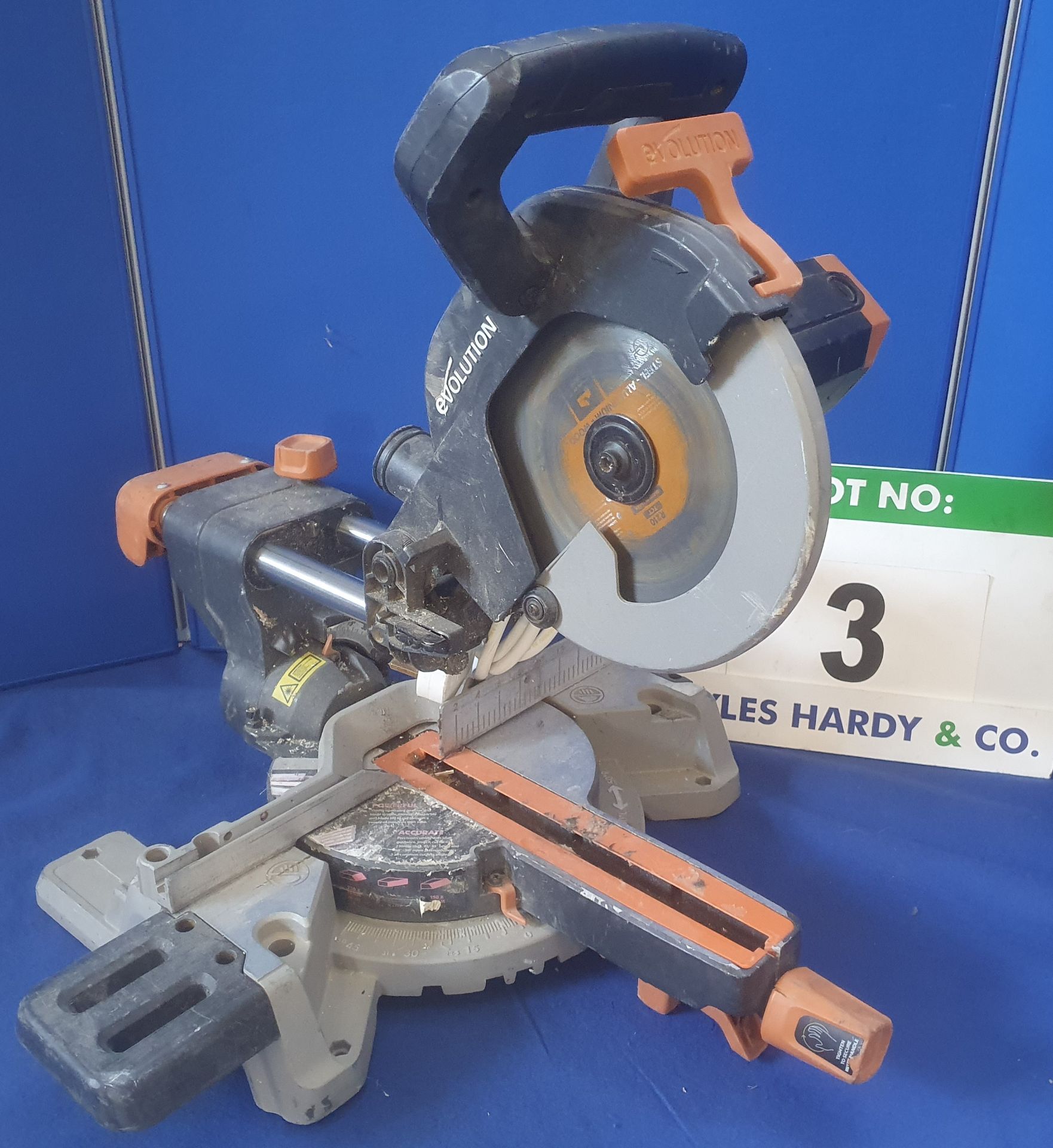 An EVOLUTION R210 240V AC, 210mm Circular Chop Action and Pull-Over Compound Mitre Saw (Note: