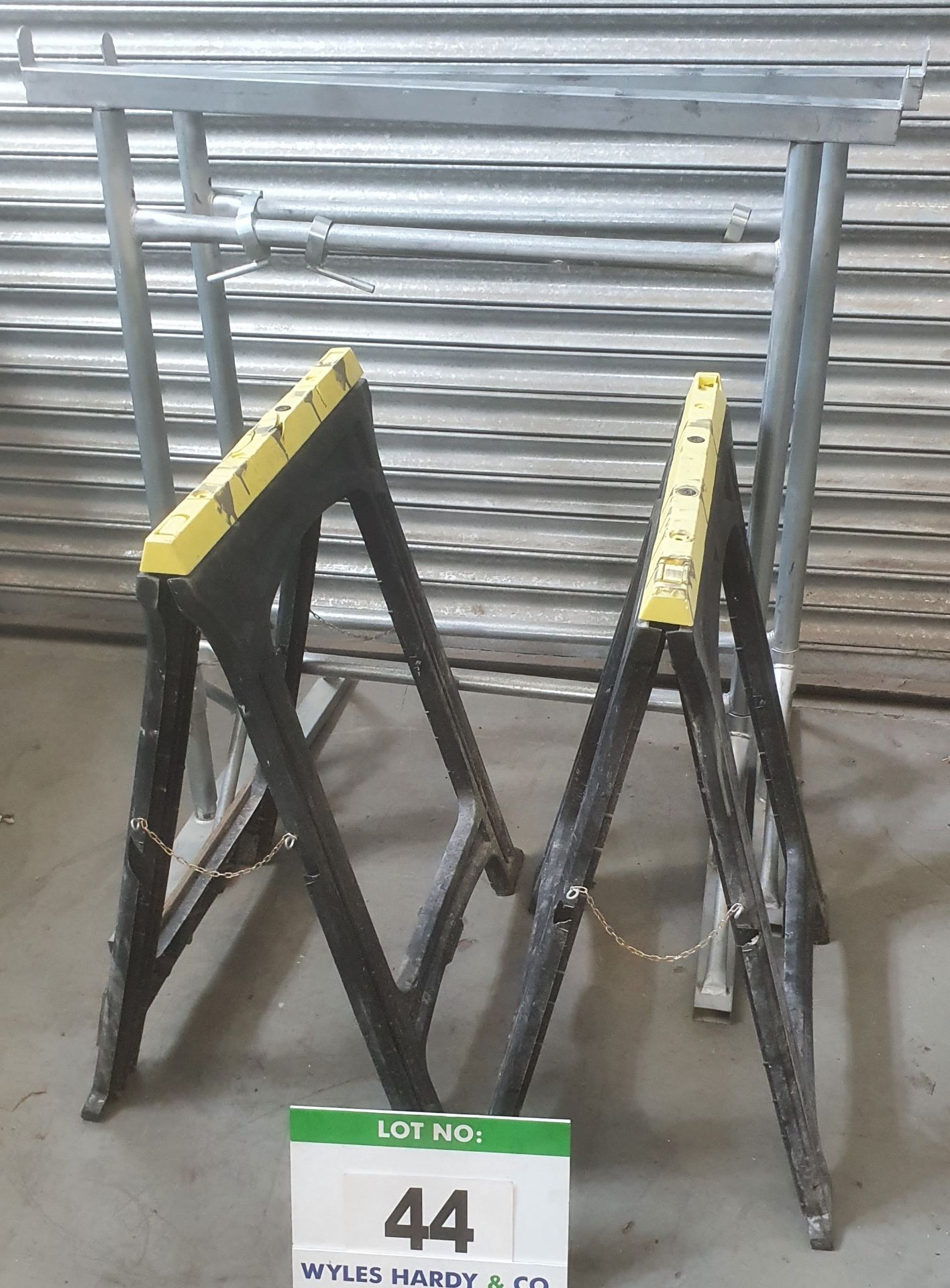 A Pair of 1020mm - 1170mm Galvanised Steel Adjustable Trestles and a Pair of Moulded Plastic