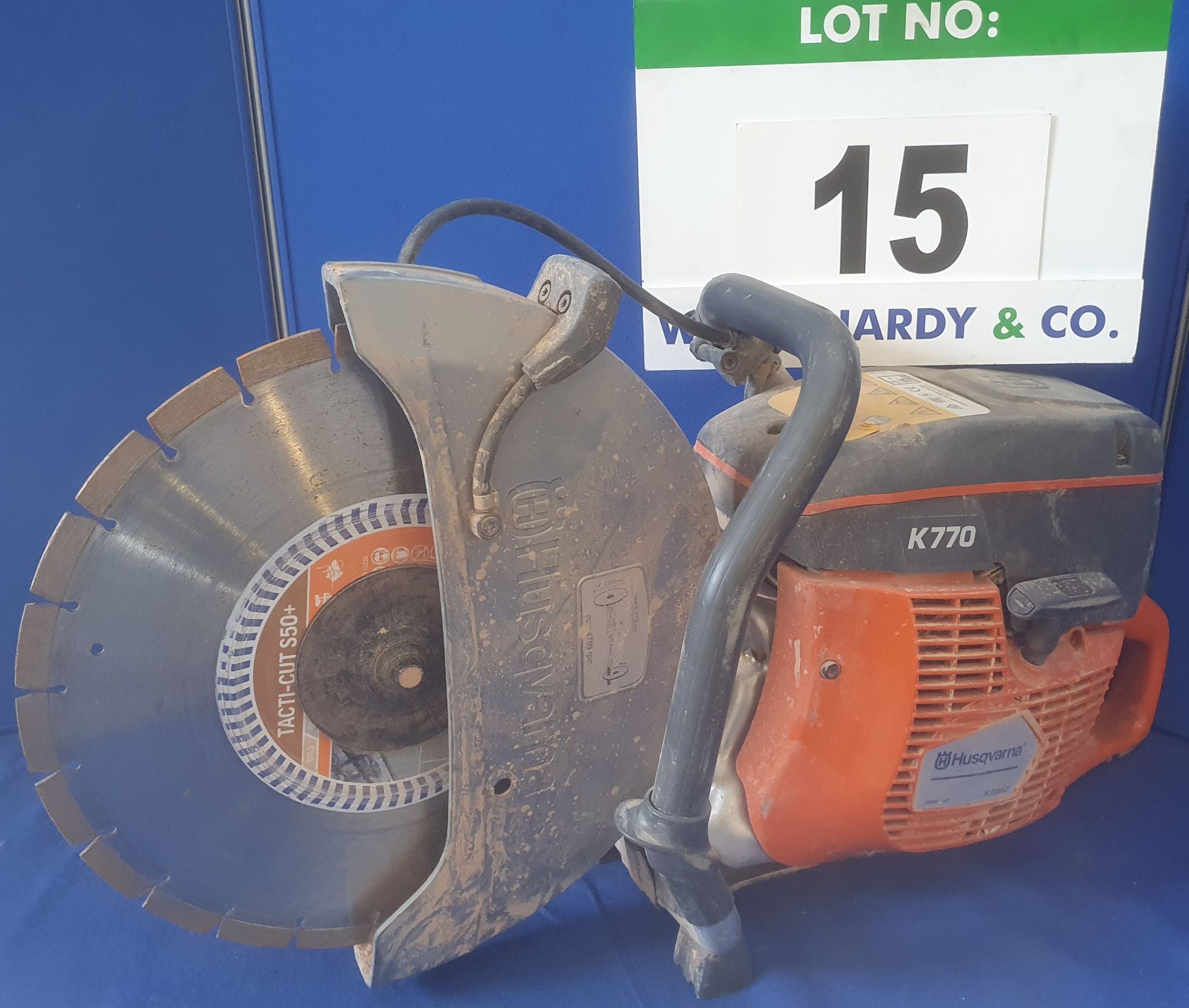 A HUSQVARNA K770 350mm Petrol Powered Hand Held Disc Cutter with Manual, Seven Bottles of 2-T Oil