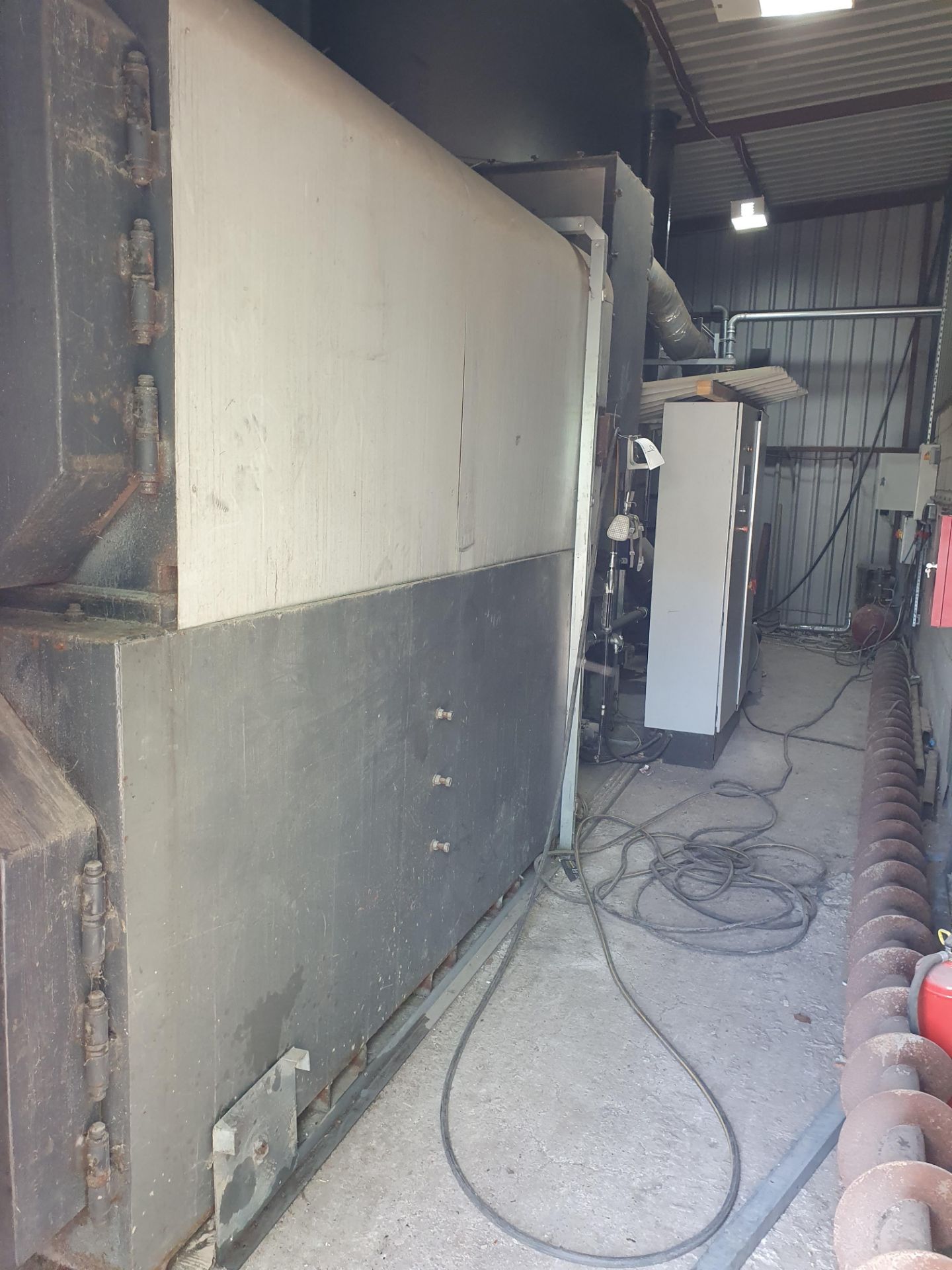 A WOOD WASTE TECHNOLOGY WW199 199kWBiomass Boiler System comprising Boiler Module, Hopper Fed In-