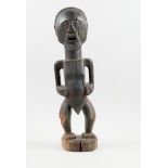 Kunsthandwerk - Afrika - Nkishi-Statue der Songye. - Holz, schwarz gefärbt.